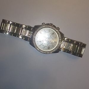 Rose gold watch diamond bezels around face